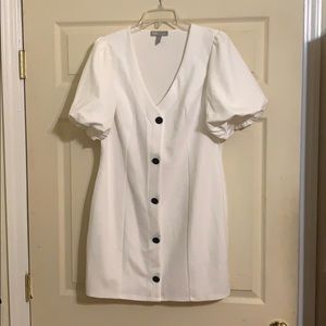 White mini dress with puffed sleeves